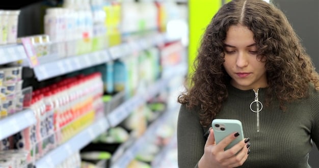 A person comparing prices of two similar products on a supermarket shelf, using their smartphone to scan barcodes and check for deals. The focus is on the individual's hands and the products, highlighting the use of technology and informed decision-making while grocery shopping.