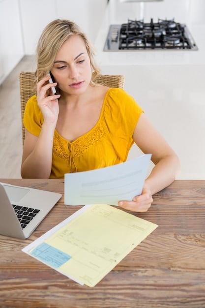 A person reviewing tax documents and transportation receipts at their home office.