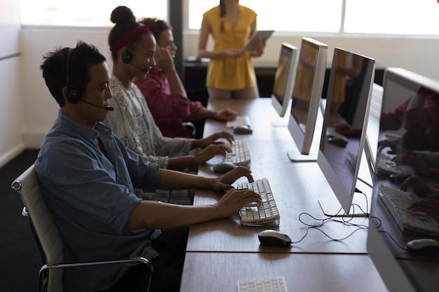 A diverse group of adult learners engaged in a hands-on cybersecurity training session, looking at multiple computer screens with lines of code, indicating upskilling in technology.