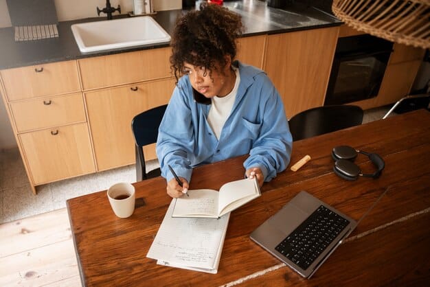 A student meticulously writing a college application essay at a desk, surrounded by notes and a laptop, emphasizing the importance of personal narratives and strong writing skills in the admissions process.