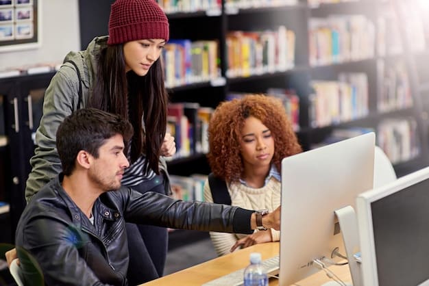 A diverse group of students in a modern university library, actively studying and collaborating on laptops.