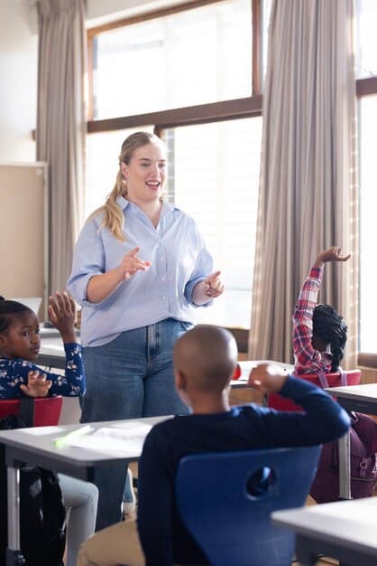 A teacher facilitating a group discussion with diverse students in a welcoming classroom, emphasizing active listening and empathy building. The environment shows posters promoting kindness and inclusion.