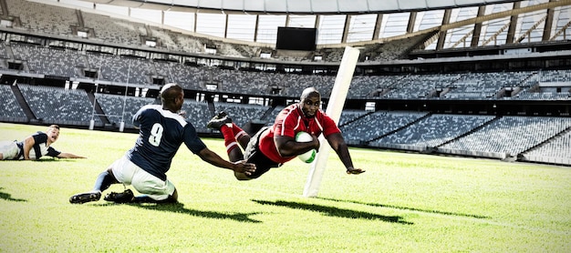 A dynamic action shot of two USMNT players in a competitive match, showcasing their agility and teamwork on a perfectly manicured pitch, with a crowd visible in the background.