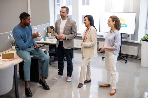 A diverse group of business professionals in a modern office, engaged in a discussion around a table with a tablet displaying financial charts, emphasizing collaboration and strategic planning in response to tax policy.
