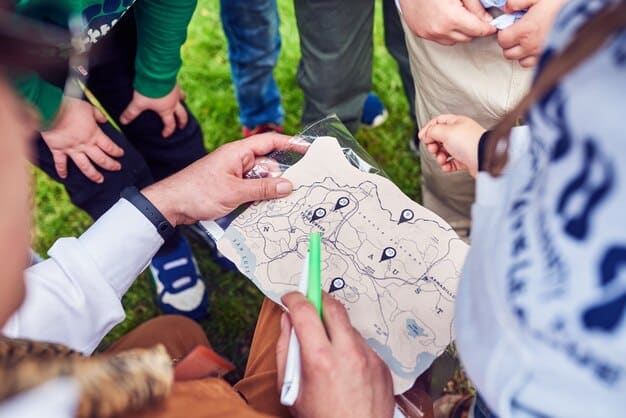 A community meeting discussing climate adaptation strategies, with diverse residents and local government officials gathered around maps and charts, symbolizing grassroots involvement.