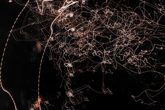 A detailed satellite image showing a network of interconnected nodes representing terrorist cells, with lines visually breaking or being cut, symbolizing disruption. The image is overlayed with faint digital data streams, suggesting signals intelligence. Colors are dark and analytical, with focused points of light showing active areas.