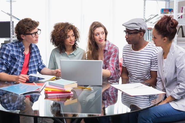 A diverse group of university students gathered around a table, actively engaged in a study session, with textbooks and laptops open, symbolizing academic effort and collaboration.