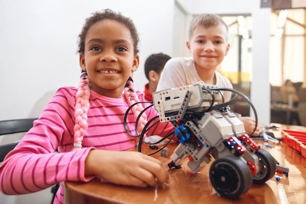 A diverse group of elementary school children collaborating on a robotics project in a bright classroom, with a teacher observing from a distance. The image should highlight teamwork and early exposure to STEM.