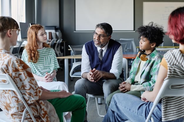 A group of teachers participating in a mental health training workshop, led by a qualified mental health professional. The session focuses on recognizing student distress signals and offering appropriate support.