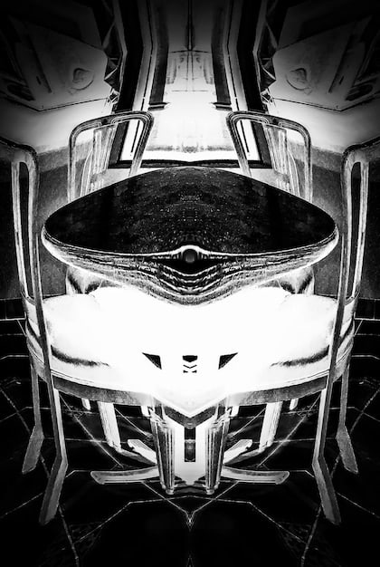 Close-up of the front of a NASCAR Next Gen car, highlighting its modernized aerodynamic features and the detailed design elements of the splitter and hood.