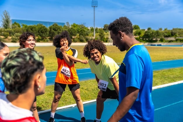 Children participating in a track and field event, with supportive coaches and parents cheering them on. The focus is on the determination and effort of the young athletes. Relates to the support for youth sports embodied by the US Olympic Committee Announces $5 Million Investment in Youth Sports Programs.