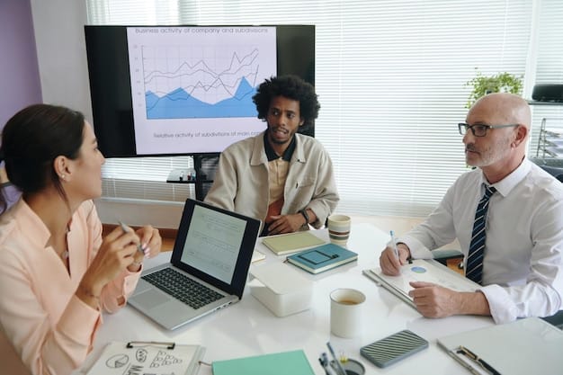A diverse group of business professionals in a modern office collaborating around a table, analyzing charts and reports related to regulatory compliance.