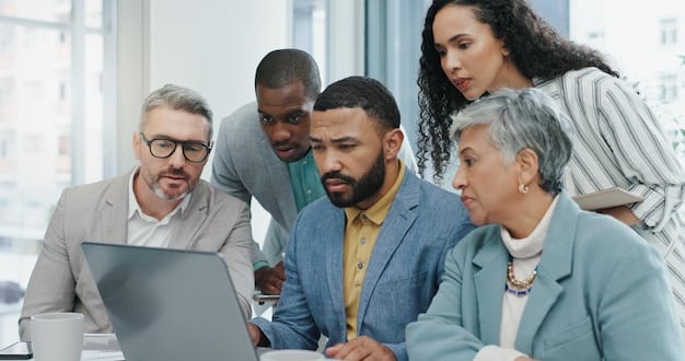 A diverse group of business professionals engaged in a serious discussion around a table with laptops, charts, and concerned expressions, symbolizing a crisis meeting.