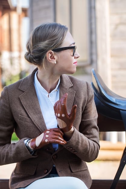 A close-up shot of a female manager in a business suit, actively listening to a team member. She is nodding and making eye contact, displaying empathy and understanding. The background is a blurred office environment, emphasizing the importance of interpersonal skills in Business Leadership: Developing Effective Leadership Skills for US Managers.