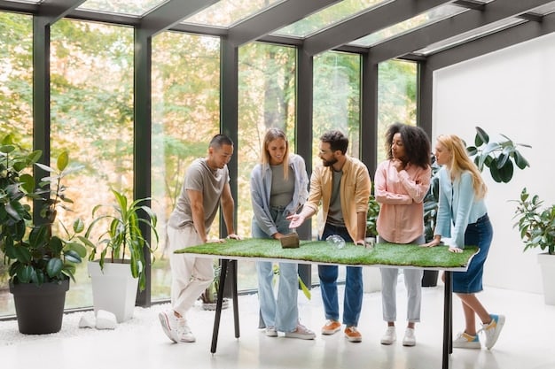 A diverse group of employees working collaboratively in a modern, eco-friendly office space. Sunlight streams through large windows, illuminating plants and greenery. The scene conveys a sense of teamwork, innovation, and commitment to Business Sustainability: Implementing Sustainable Practices in US Companies for Long-Term Success.
